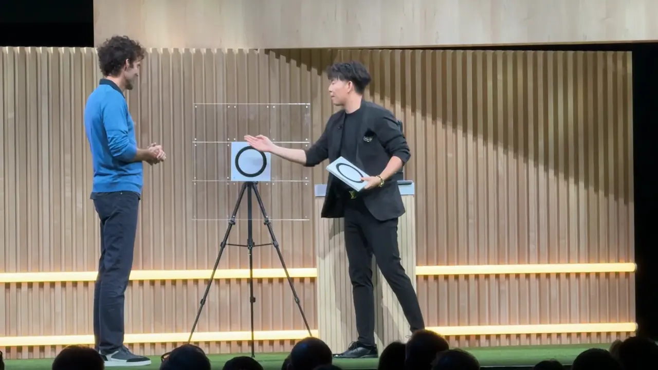 Johnny Wu on stage at Google HQ with a volunteer during the show